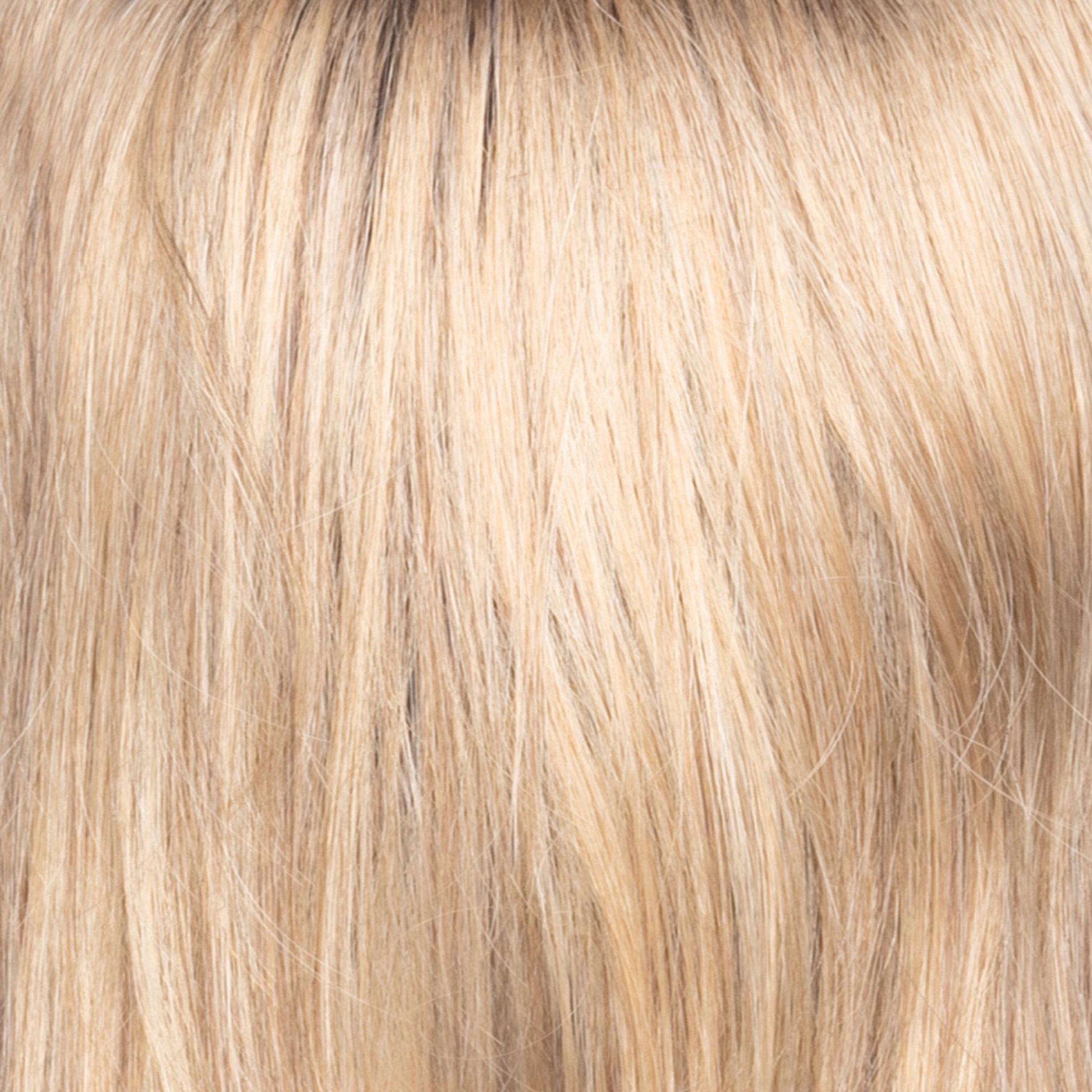 Butter Pecan-R  -  The rooted sister of butter pecan has an additional color of warm chocolate brown placed at the root as a regrowt. This pecan blond which melts into many tones of warmth, runs into a toasted pecan white. The creams throughout it look extremely natural and blend through the length.