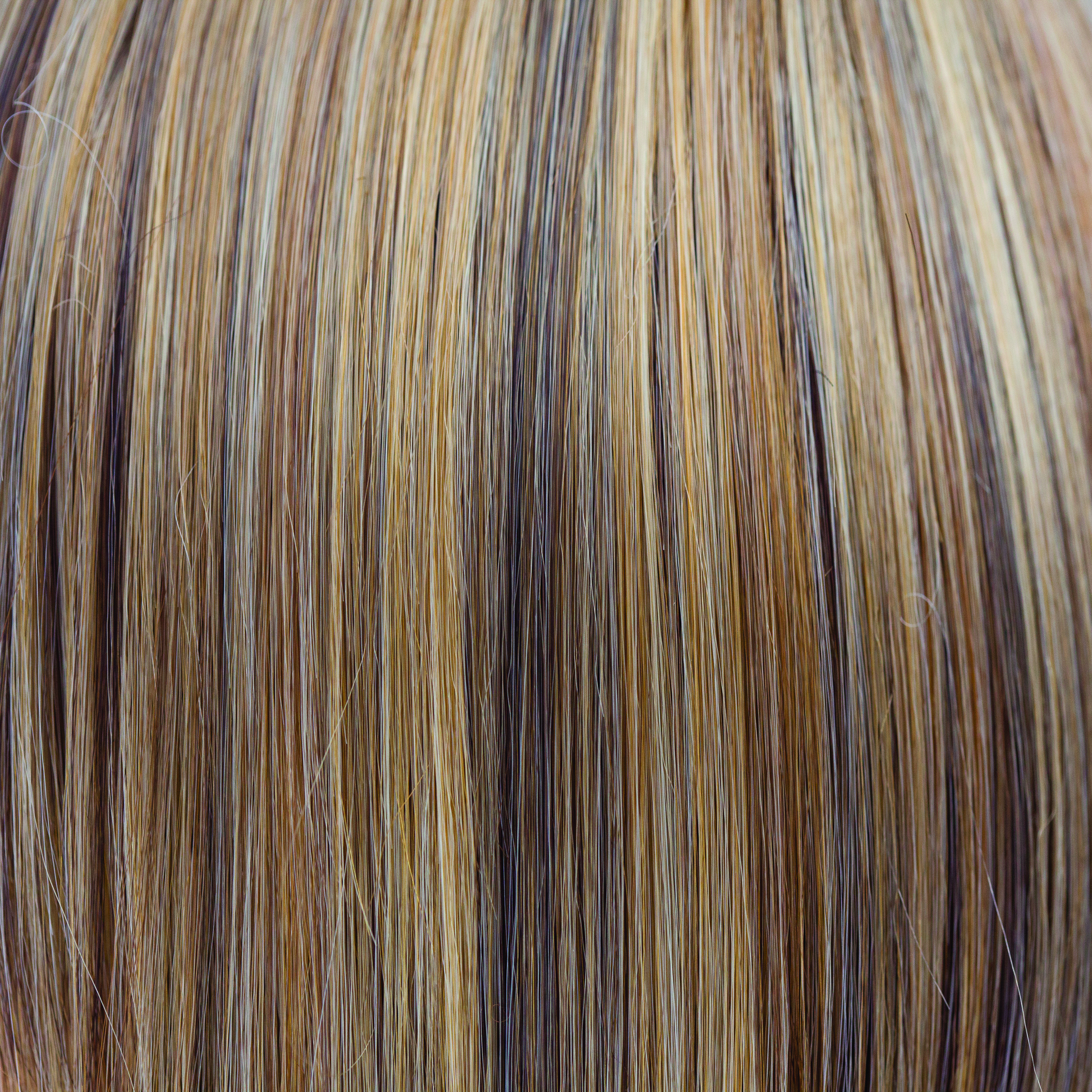 Butter Pecan  -  A pecan blond which melts into many tones of warmth, runs into a toasted pecan white. The creams throughout it look extremely natural and blend through the length. This multidimensional blond is lovely, luscious and really warms the skin tone.