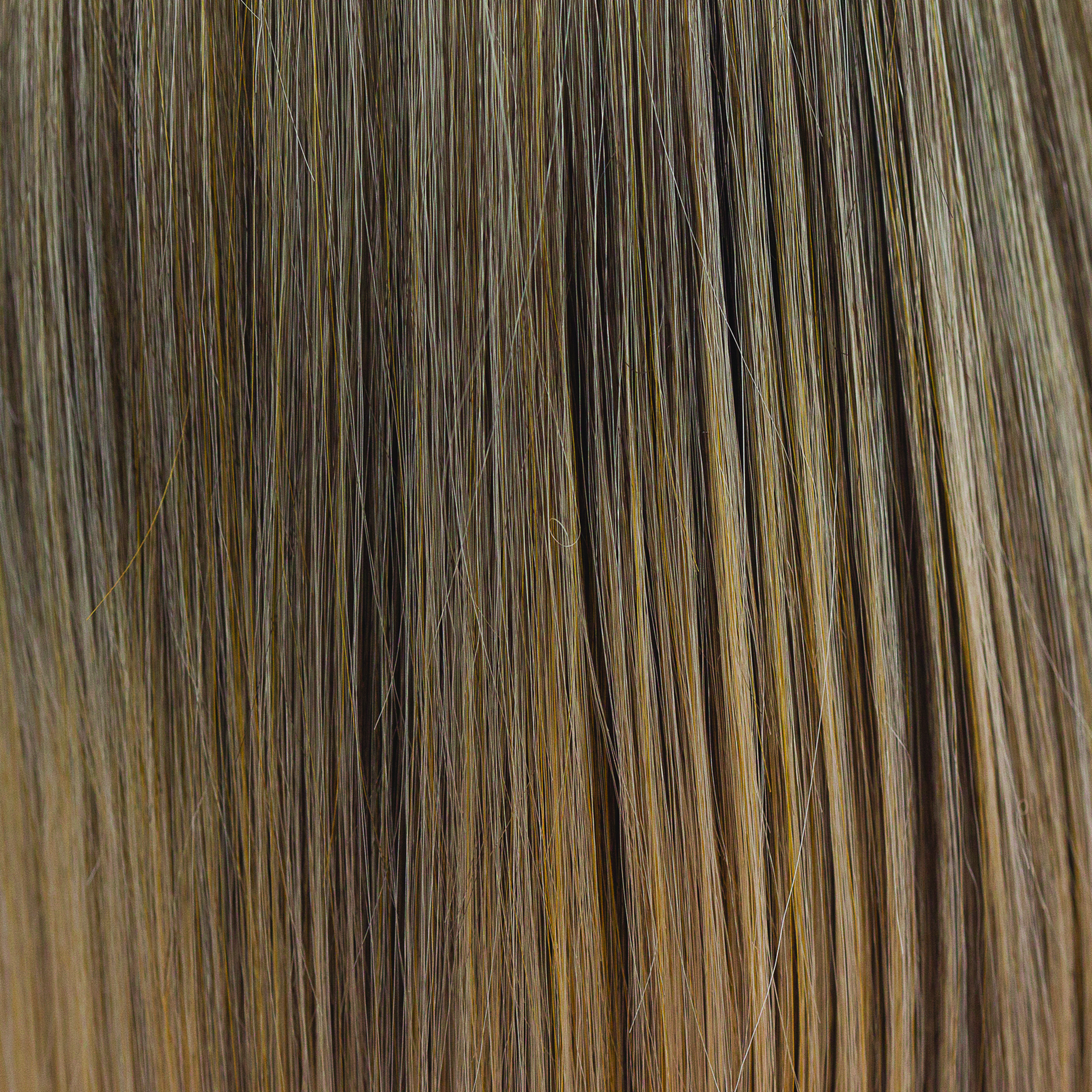 Buttered Toast  -  A medium blond smoky infusion of colors! Buttered Toast has a graduated blend of sandstone blonds and soft truffle weaves, with dark beige blond slices and buttery blended undertones.