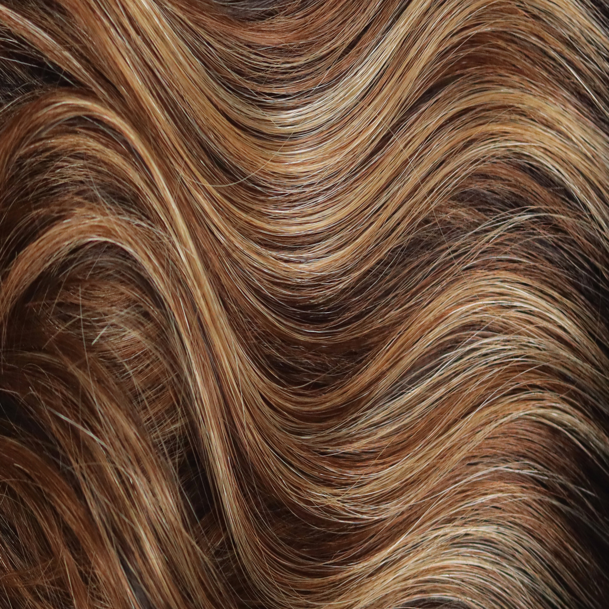 Chocolate Pretzel  -  A swirly delight as it combines a dark brown base with a delightful cascade of medium honey blond and medium coppery highlights. Empower any look with this modern brown color.
