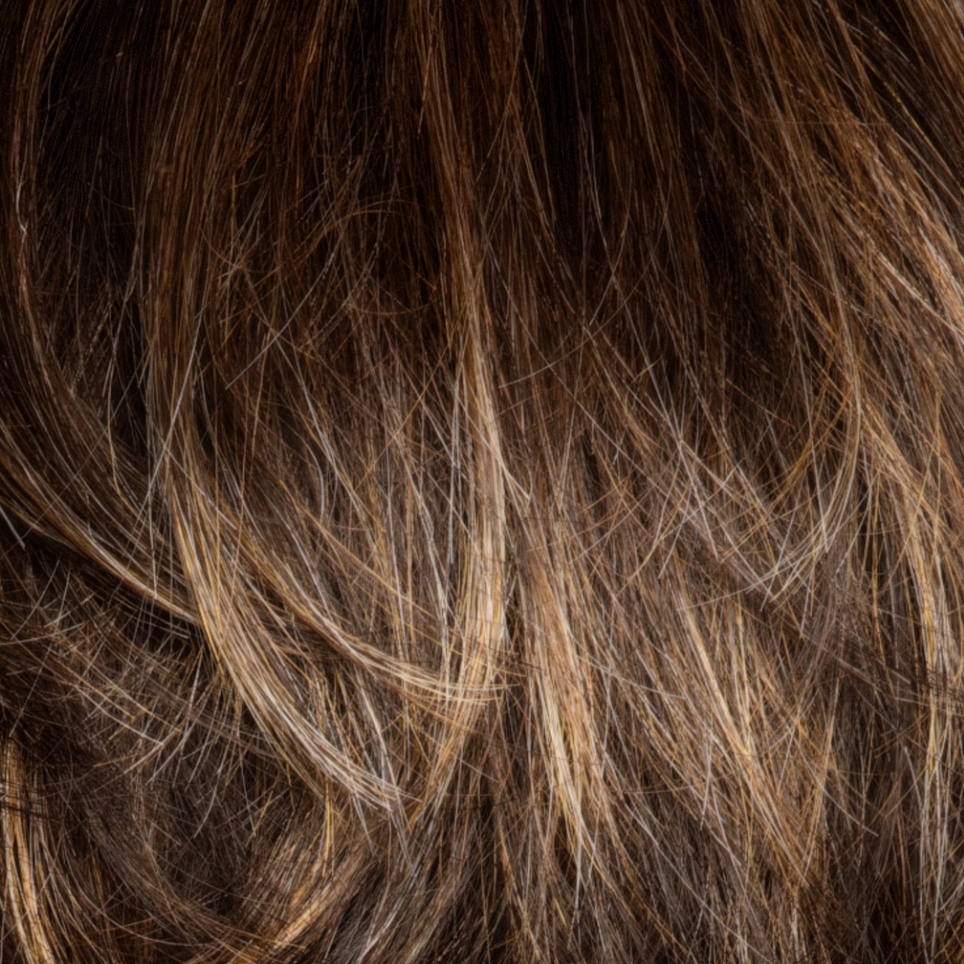 Chocolate Twist  -  Beautifully blends the dark brown color Cappucino as the base, with coppery blond highlights and tipped ends. The result is a multi-dimensional natural and flattering brown.