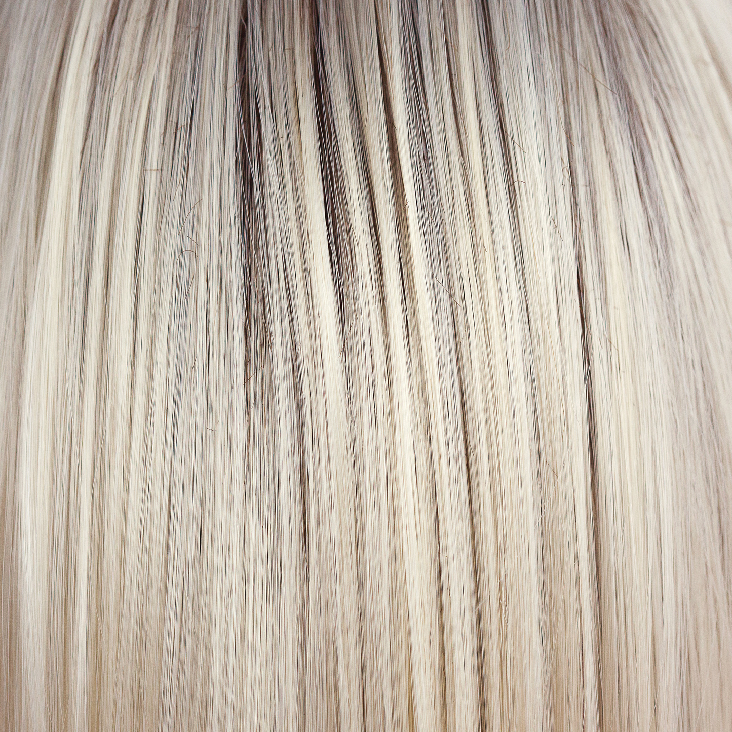 Coco Cream - A rich dark chocolate base that pushes the boundaries with its stunning displays of lily white chunky blond weaves and pale natural ash blond slices. Maximizing the impact of the style!