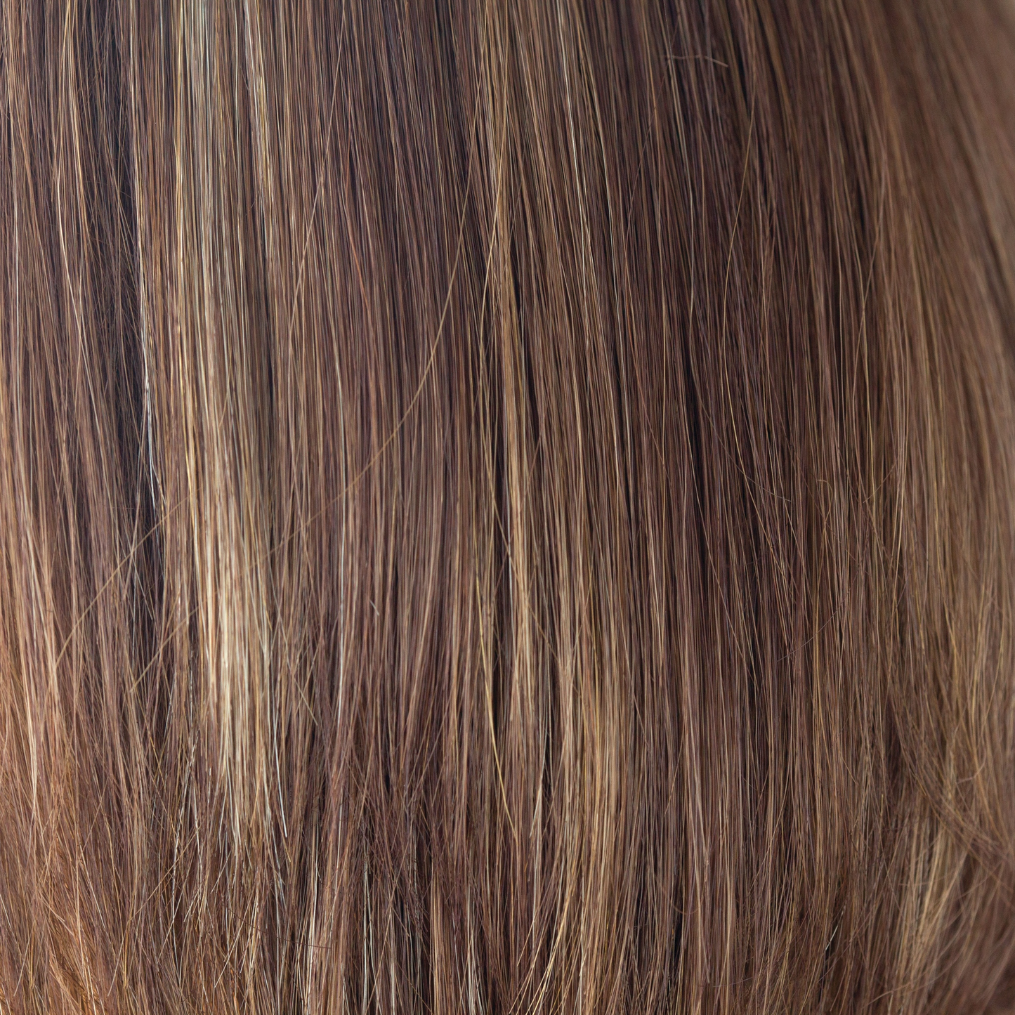 Coconut Spice - This medium red copper brown has a tasteful blend of lighter red and dark blonds. Coconut Spice has twists of pale coconut blonde shades throughout, spicing up this spectacular color. This continues to be a popular choice world over.