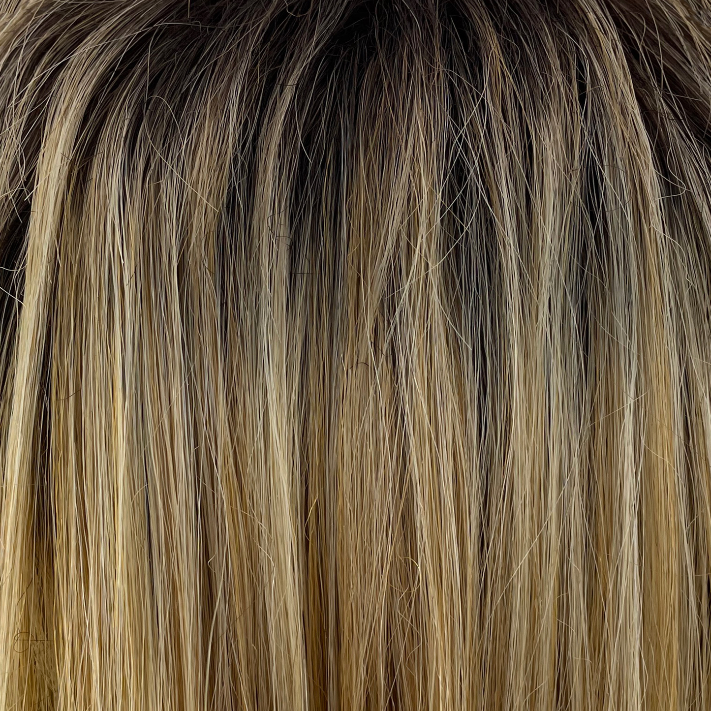 Cream Velvet - A beautiful rooted blond with a medium warm mocha root blending into smooth velvet and cream blonds expertly woven to giving a stunning salon inspired finish.