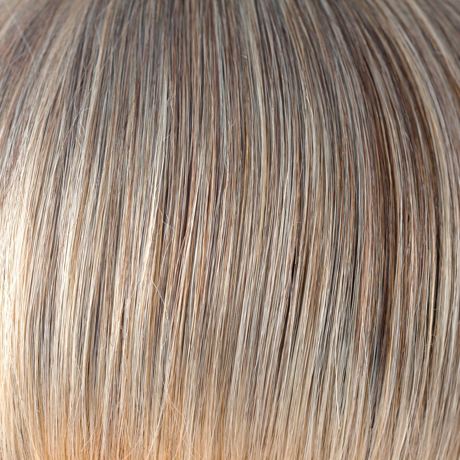 Frosti Blond  -  An ashy finely highlighted color, coming from a gentle root of dark blond. This is a very natural color, conservatively cool and sophisticated. Frosti Blond continues to wow us in any style!