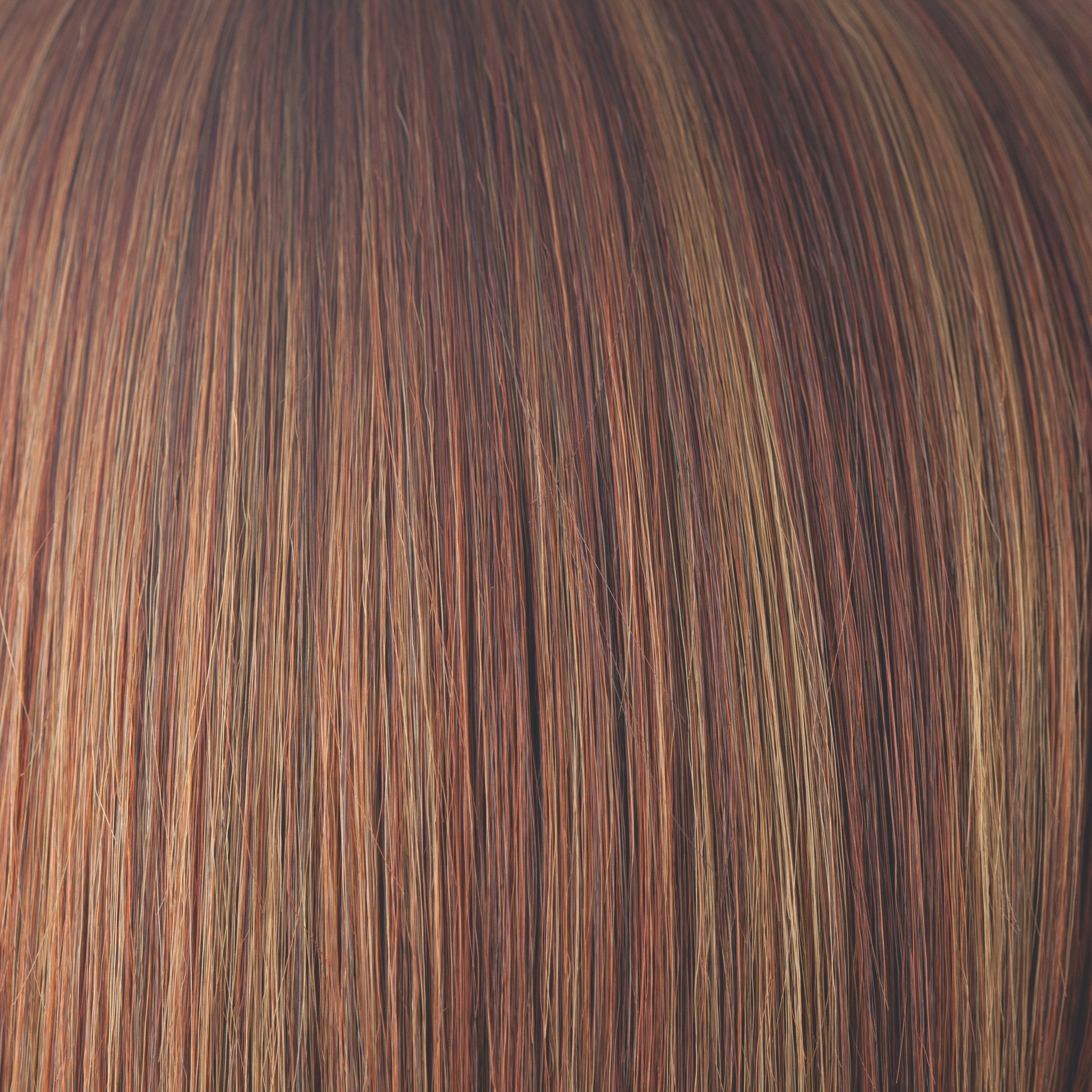 Irish Spice-R  -  This rooted version of Irish Spice has a medium red brown root regrowth. Irish Spice-R is a color that has a delightful blend of medium and light brown slices and cool copper highlights, with chestnut tones and a dark brown red copper undertone.