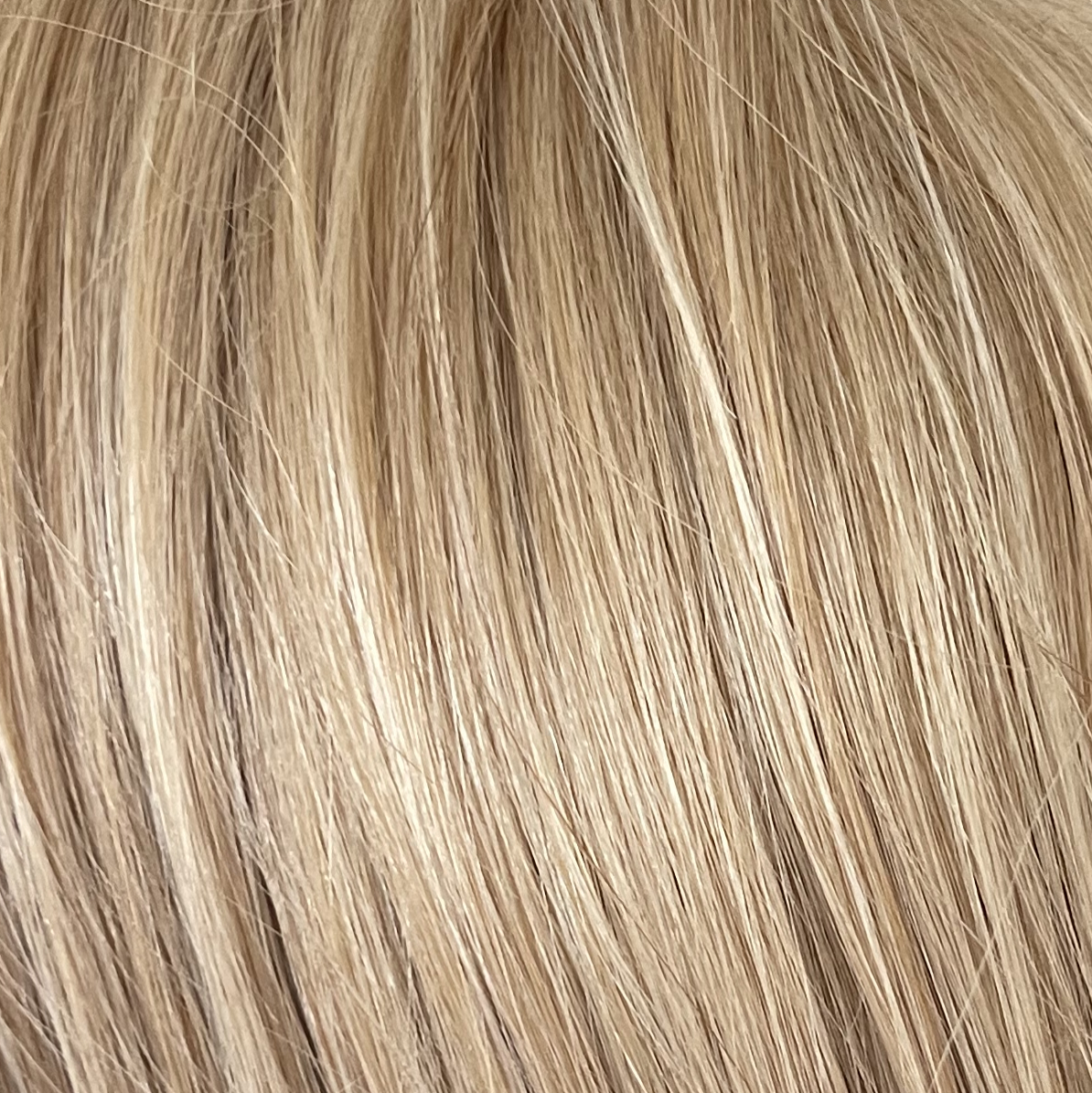 Marigold - A toffee toned blond, that is wonderful in any style it comes in. This pale golden blond with finely woven creamy highlights, is a real head turner!