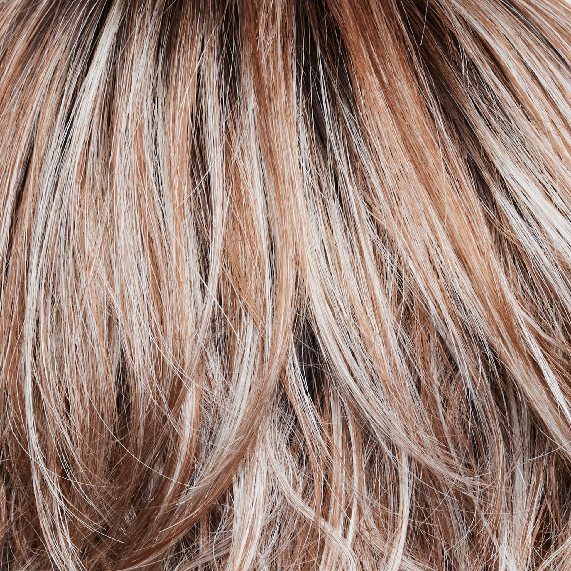 Melted Cinnamon  -  A medium-brown root tone that melts into the cinnamon blond base color. It's then topped off with icy blond ends.