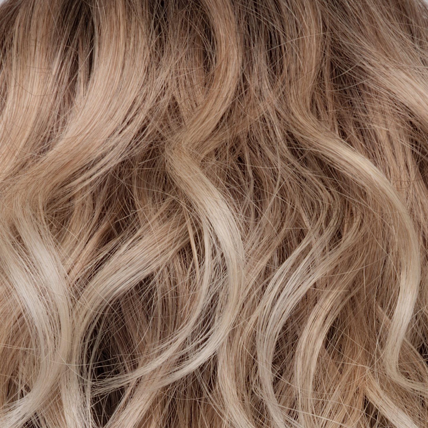 Melted Sand - Rich, warm brown root melts into the neutral blond tone. Light-beige blond ends complete this stunning color.