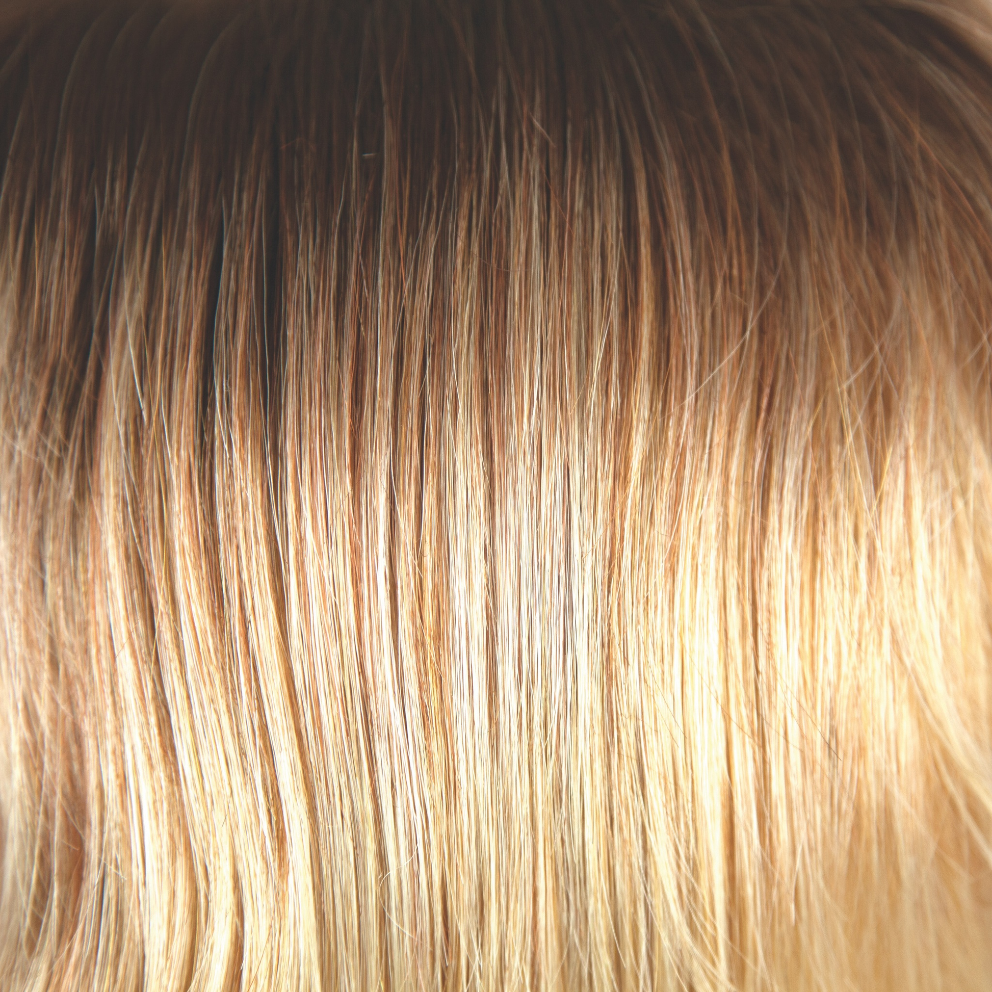 Melted Sunset  -  An extremely popular and beautiful color. Similar to melted marshmallow but much, much warmer and golden. Starting with dark golden pearl brown flowing into medium amber blonds with a saffron sizzle and bright gold sunbeam blonds on the ends and tips.