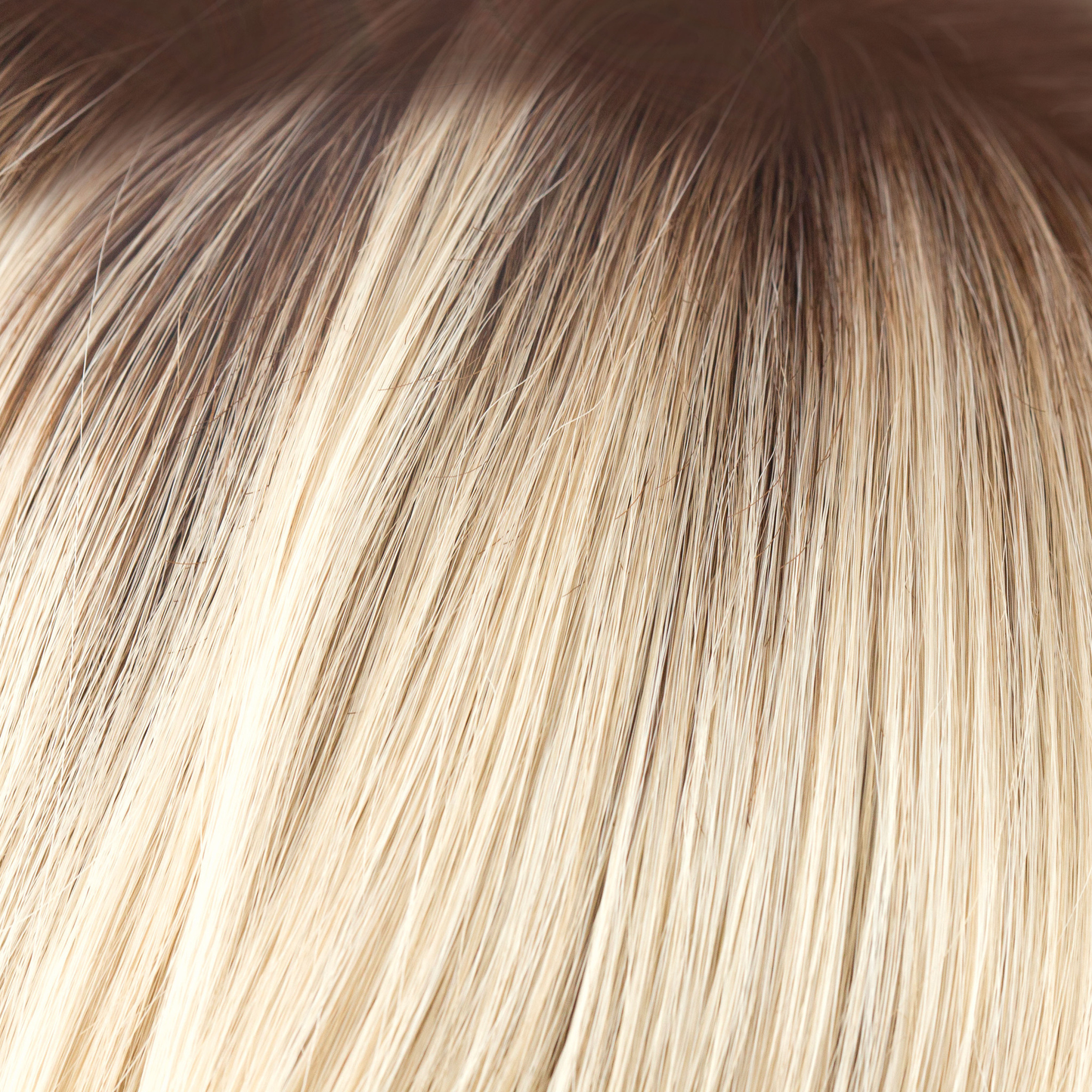 NM Champagne-R - A luxurious color with many fine tones of blond. Cream blonds, champagne hues and pale gold undertones make the blond a work of art! The medium warm brown root gives it the most natural of regrowths and keeps it looking very realistic.