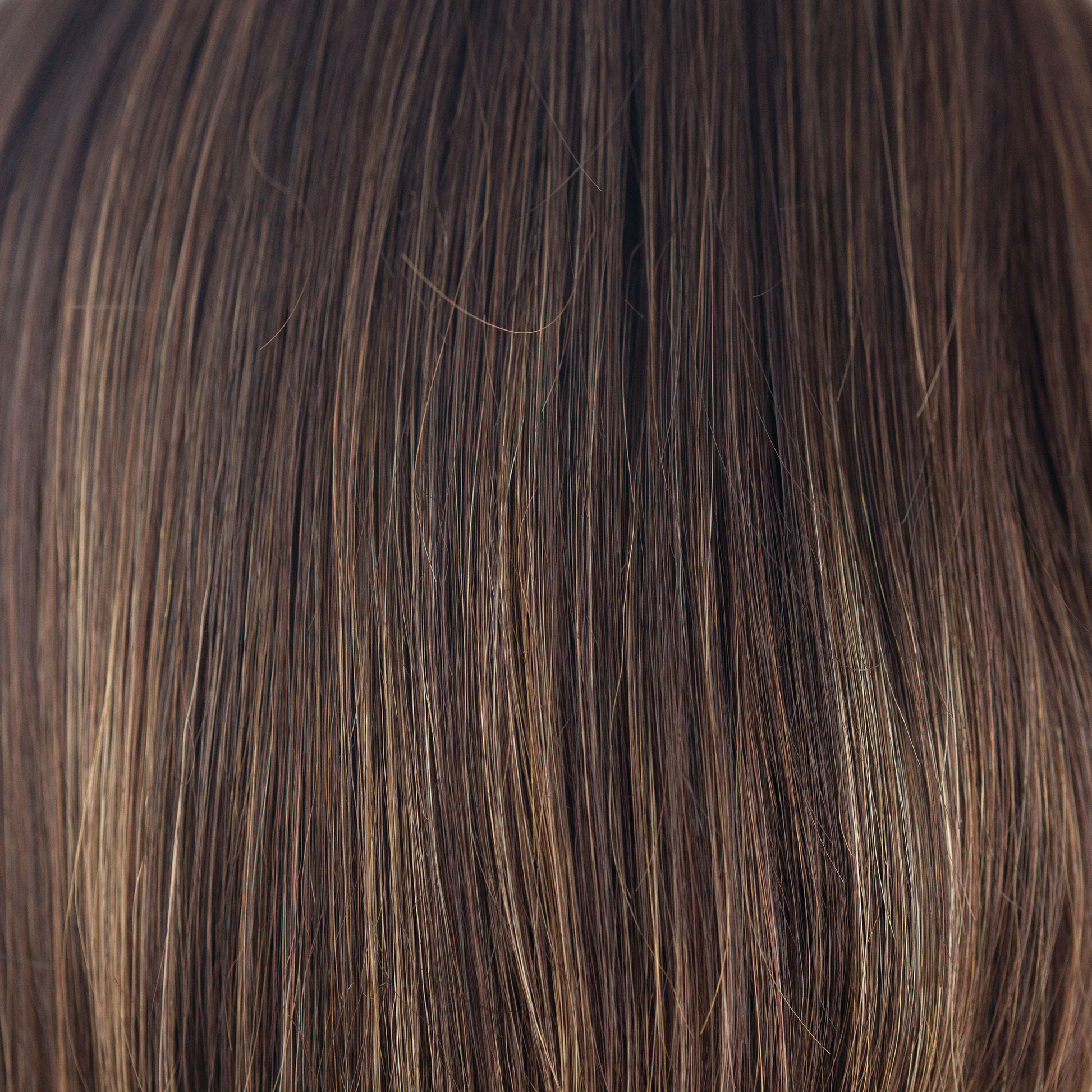 NM Coffee Latte  -  A Cappucino-base with a mix of warm medium brown and medium golden blond highlights. With strategically placed highlights throughout, the warm toned color will highlight and warm the skin tone.