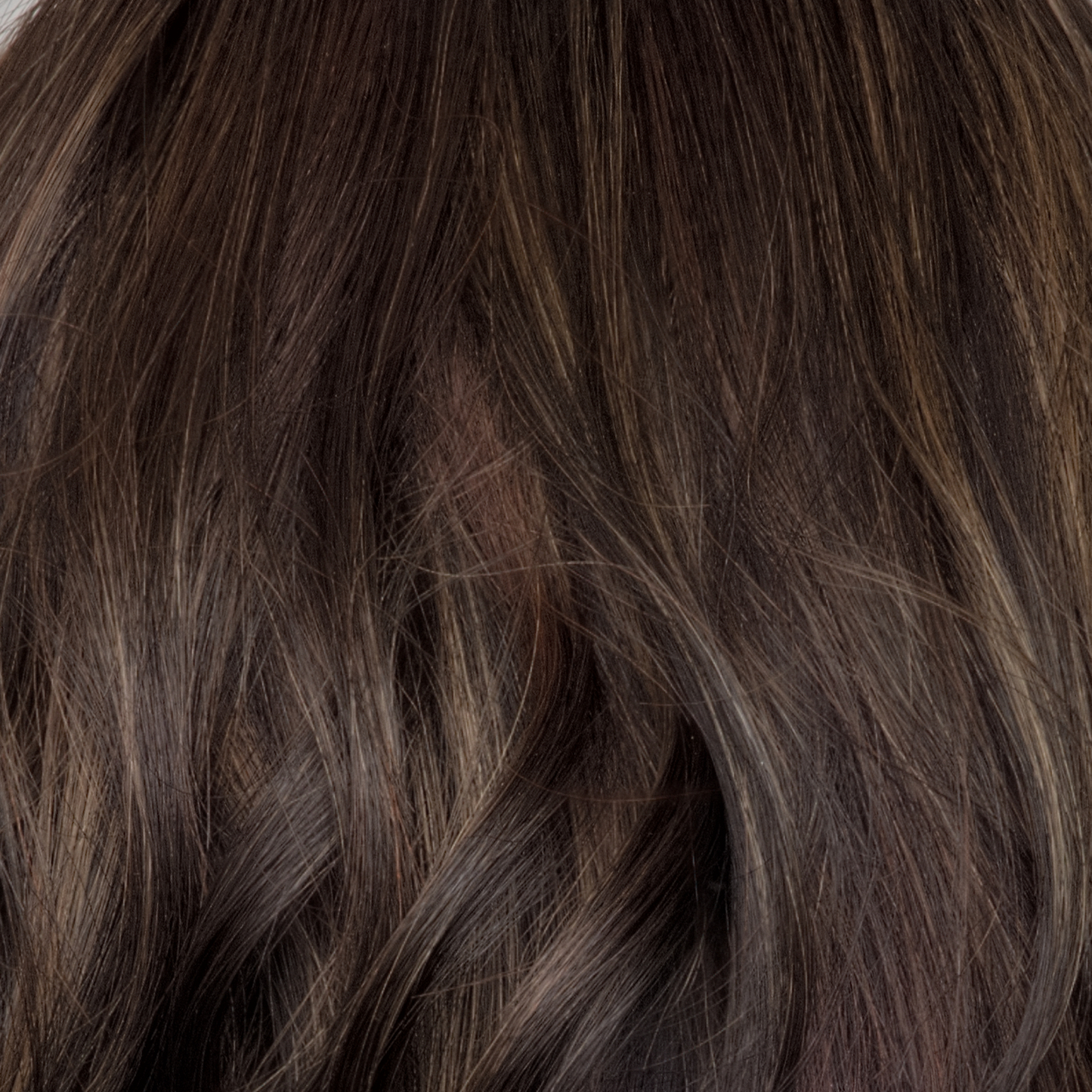 Spiced Mocha-R - A dark-brown base with perfectly placed warm-medium brown and medium reddish-brown highlights. The root tone adds a natural shadowed effect.