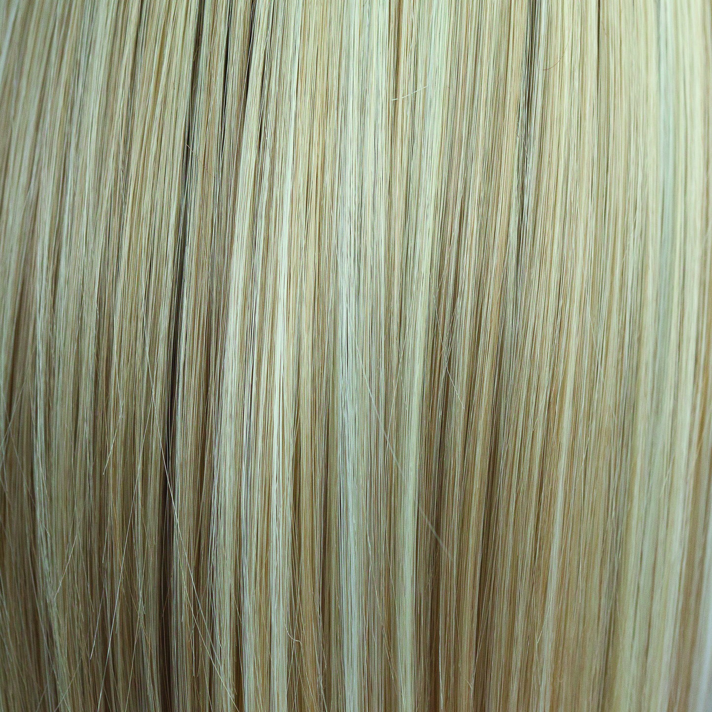 Sugar Cookie - This is a creamy blond color with thick ribbon weaves of toasted biscuit, honey blonds and porcelain whites all running through.