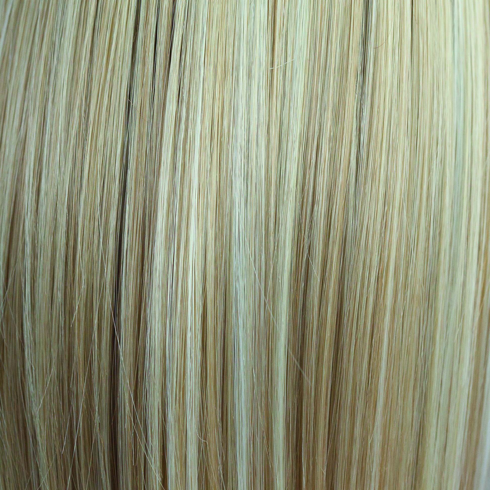 Sugar Cookie  -  This is a creamy blond color with thick ribbon weaves of toasted biscuit, honey blonds and porcelain whites all running through.