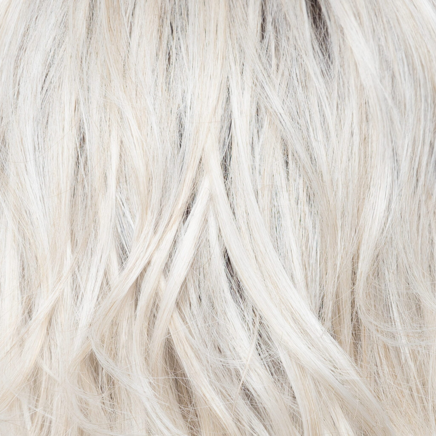 White Rose Blond-R - A white blond base with subtle warm brown highlights. The medium-brown root creates a vibrant appearance.