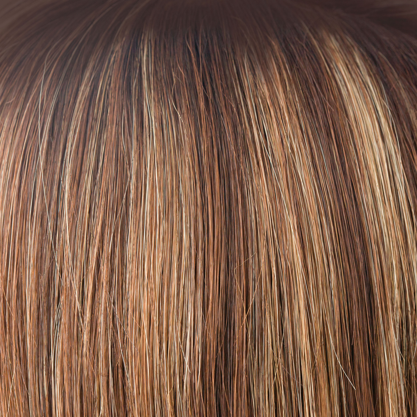 NM Auburn Sugar  -  A mixed red with a medium auburn brown base. The color is highlighted with a blend of golden and cherry blond with fine smoky blond slices and tones of copper.