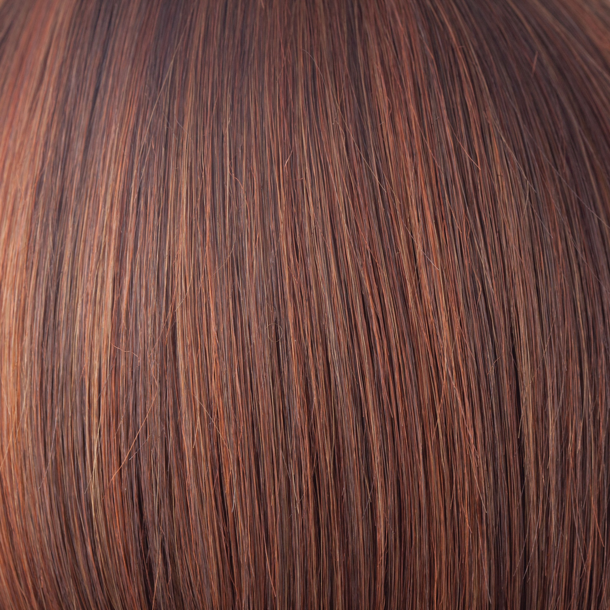 NM Chestnut  -  To make this color we have blended a multitude of medium brown red to make an unrivaled chestnut. Chesnut has a subtle twist of color blending slightly lighter towards the ends. It is understated, natural and complements all skin tones.